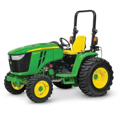 Compact green and yellow agricultural tractor with large rear tires, open operator seat, steering wheel, and roll-over protection bar against a white background.
