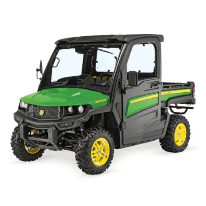 Compact off-road utility vehicle with enclosed cabin, green and black body, yellow wheels, and cargo bed designed for rugged terrain tasks.