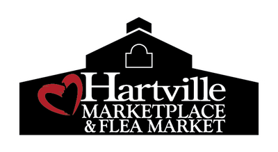 Black silhouette of a large barn-shaped building with a red heart outline next to the white text reading Hartville Marketplace & Flea Market in a bold serif font.