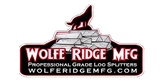 Logo featuring a silhouette of a howling wolf atop stacked logs with bold text reading Wolfe Ridge MFG and their website below on a transparent background